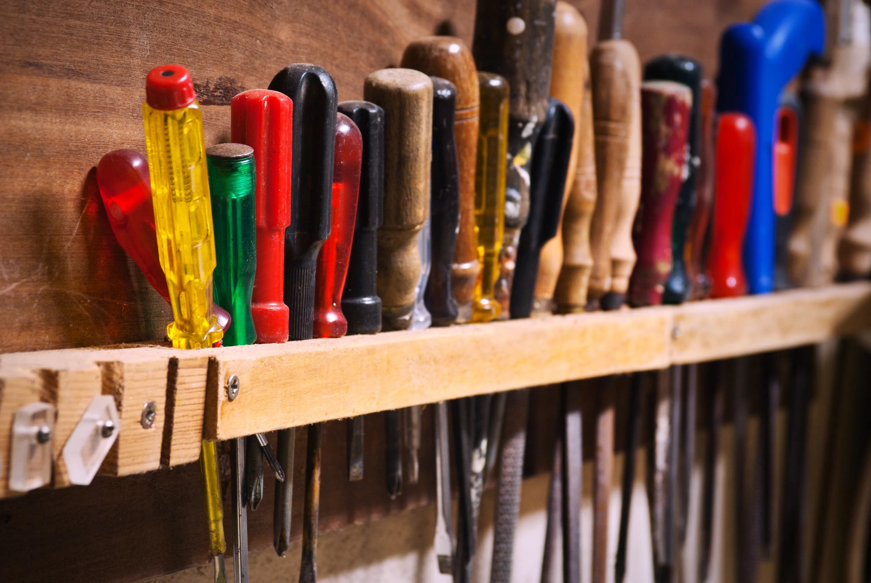 An organized set of screwdrivers and hand tools